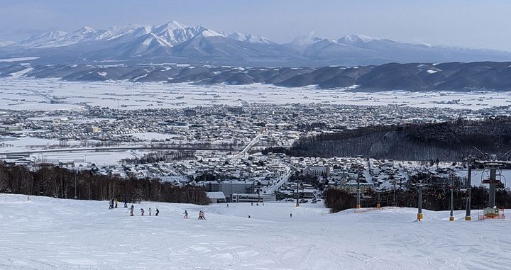 The village of Kitanomine with Furano city behind and the Tokachidake mountains in the background. Photo: Scout - image 0